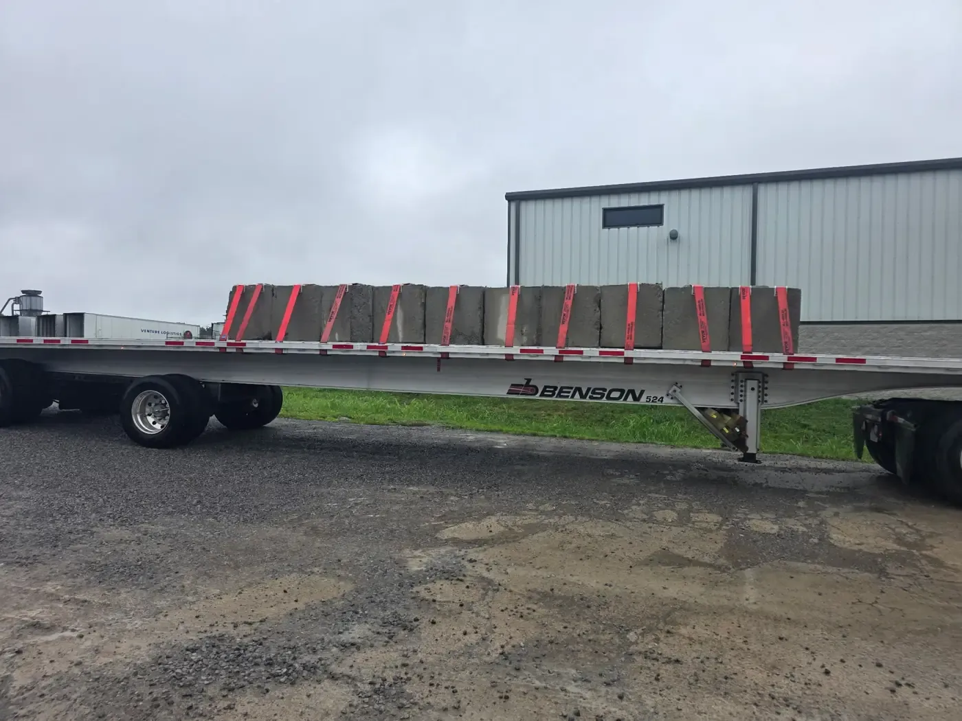 Concrete blocks strapped across a flatbed deck, ready to leave the yard